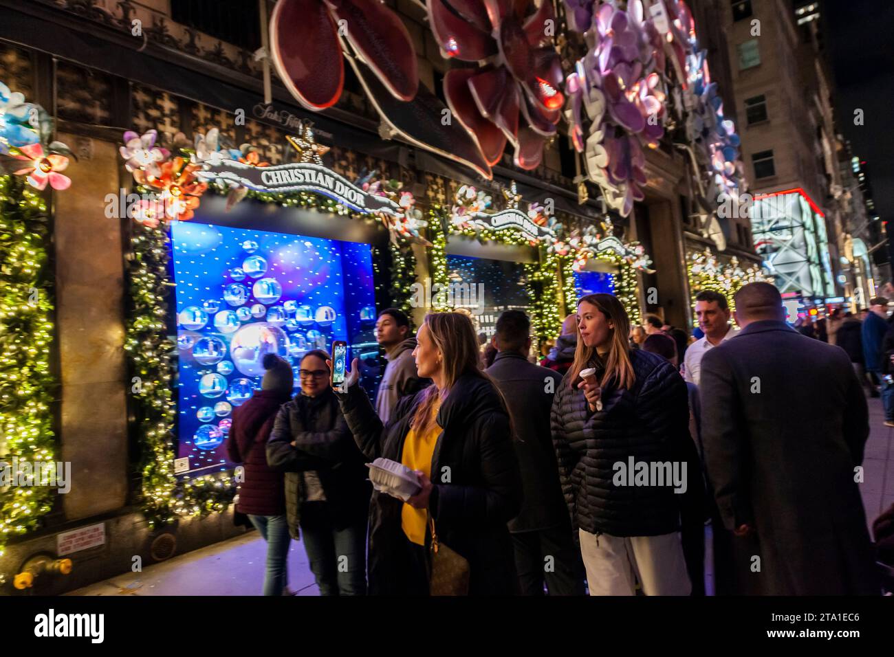 Thousands of visitors crowd Saks Fifth Avenue in New York to view their worldfamous Christmas