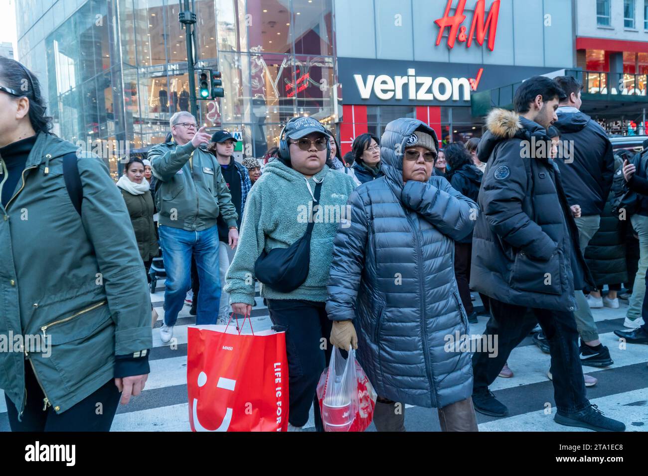 Hordes of shoppers outside of Macy's Herald Square flagship store in New York anxious to shop on the day after Thanksgiving, Black Friday, November 24, 2023 The National Retail Federation predicts 182 million people will shop over the Black Friday weekend, both in-person and online, culminating in Cyber Monday. (© Richard B. Levine) Stock Photo