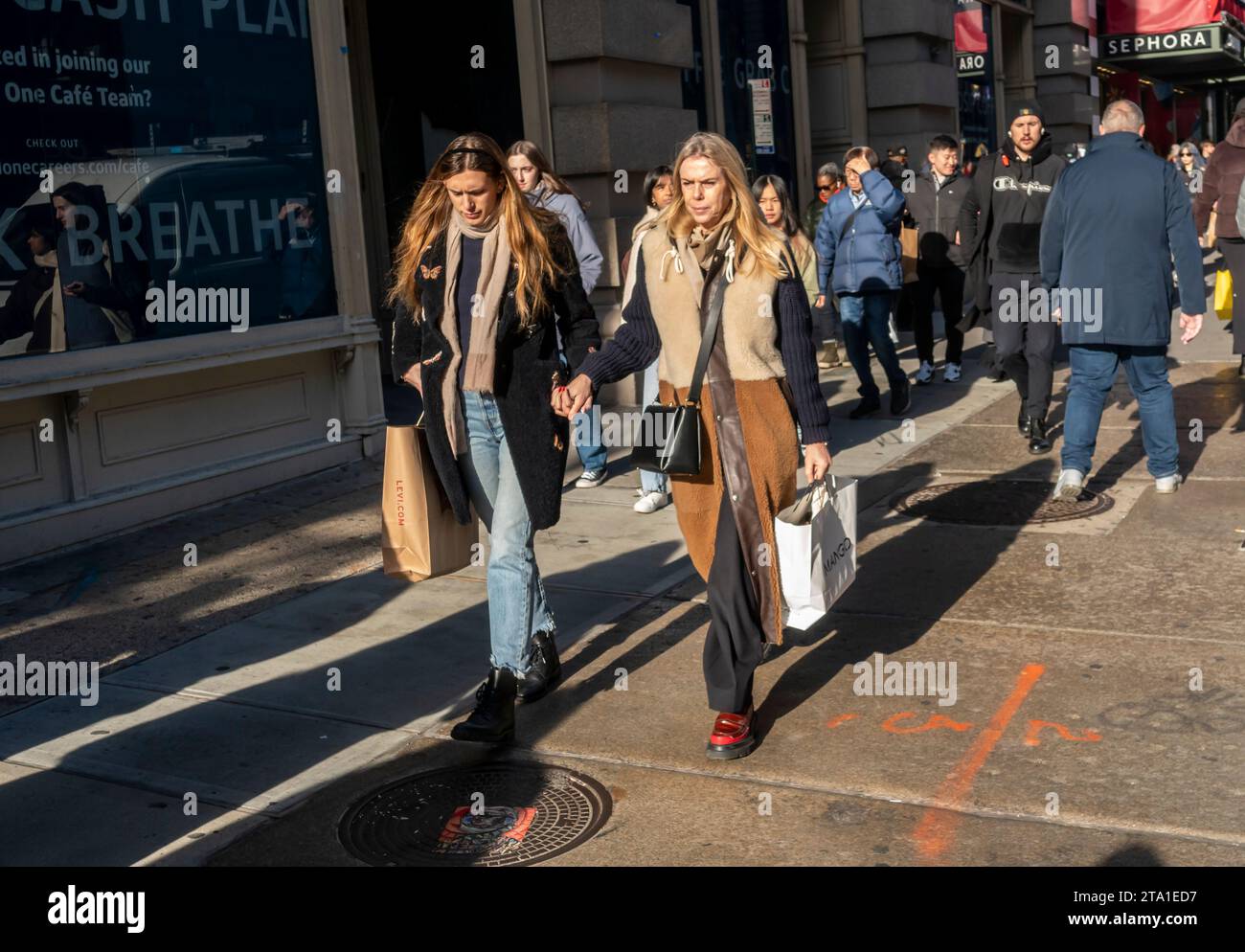 Shoppers in the Soho neighborhood of New York on Saturday, November 25, 2023 during the Black Friday weekend.The National Retail Federation predicts 182 million people will shop over the Black Friday weekend, both in-person and online, culminating in Cyber Monday. (© Richard B. Levine) Stock Photo