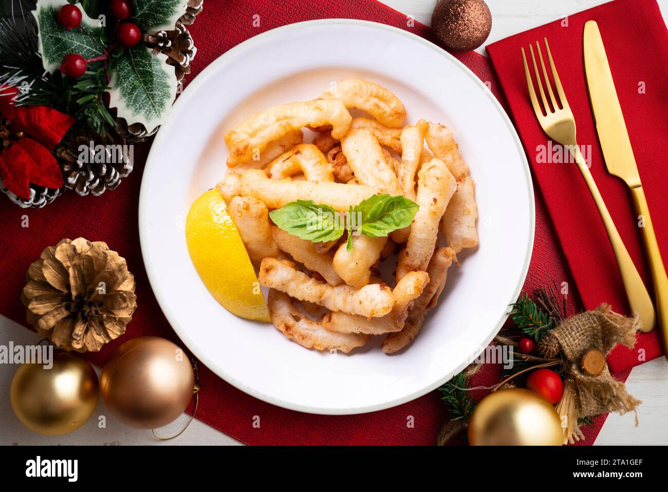 Traditional spanish tapa. Rabas, tasty fried squid with lemon ...
