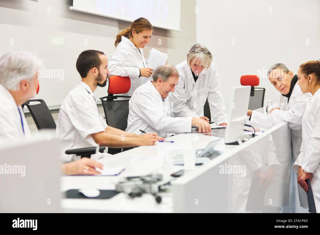 Speaker panel with male and female doctors at medical health care