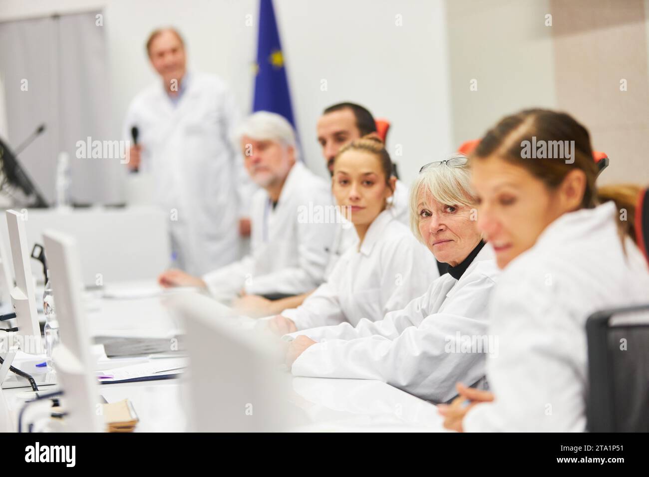 Speaker panel with male and female doctors at medical health care conference Stock Photo
