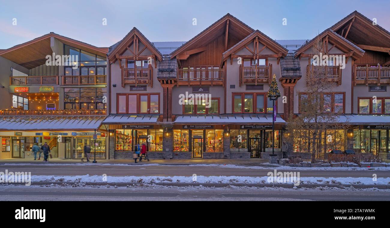 Banff, Alberta, Canada – November 27:  Shoppers and stores on Banff Avenue in the downtown district Stock Photo