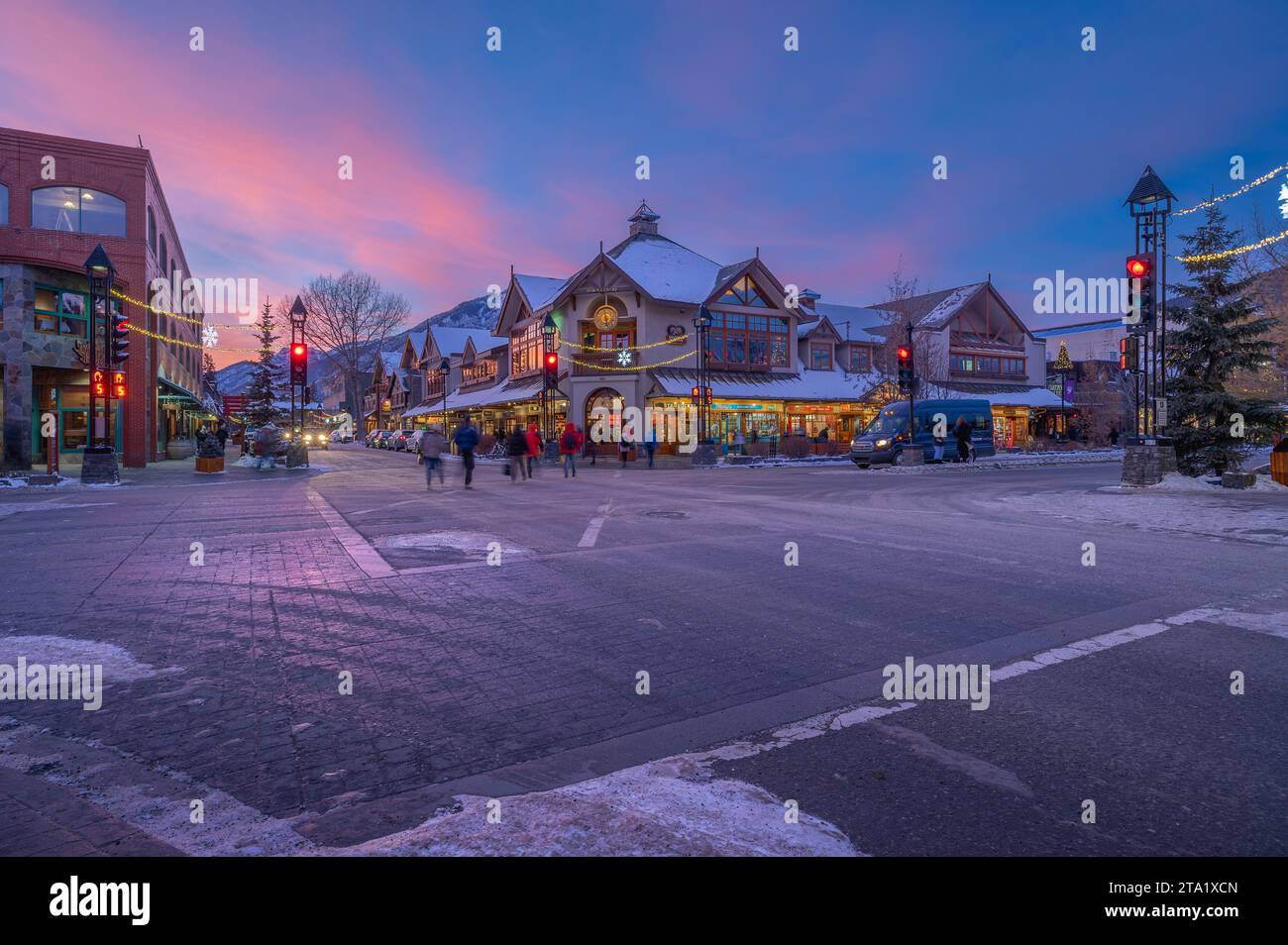 Banff, Alberta, Canada – November 27:  Shoppers and stores at a Banff Avenue intersection in the downtown district Stock Photo