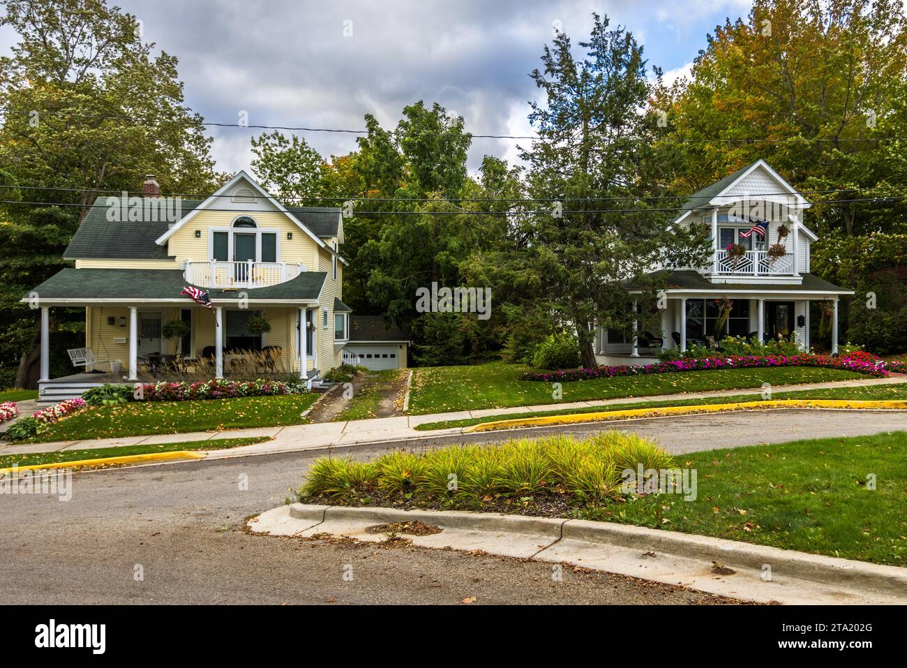 Wooden houses with Stars and Stripes flags in the Earl Young Local