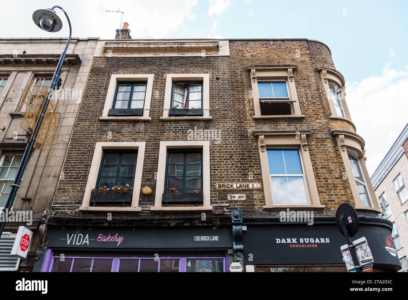 London, UK - August 25, 2023: Low angle view of traditional old buildings in Brick Lane, East End Stock Photo