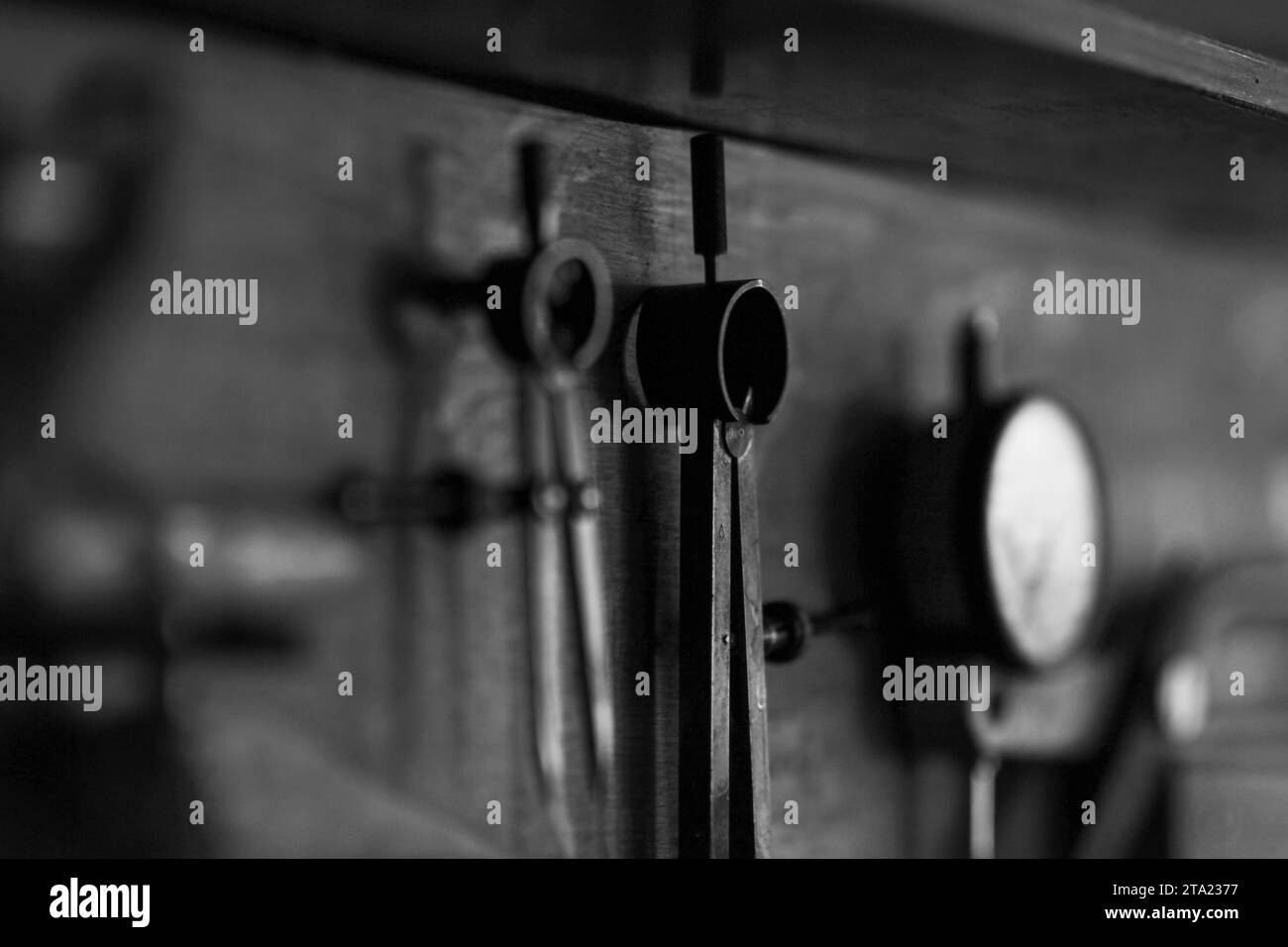 Tool set of expert violinmaker luthier artisan workshop in Cremona, black and white, selective focus, bokeh Stock Photo