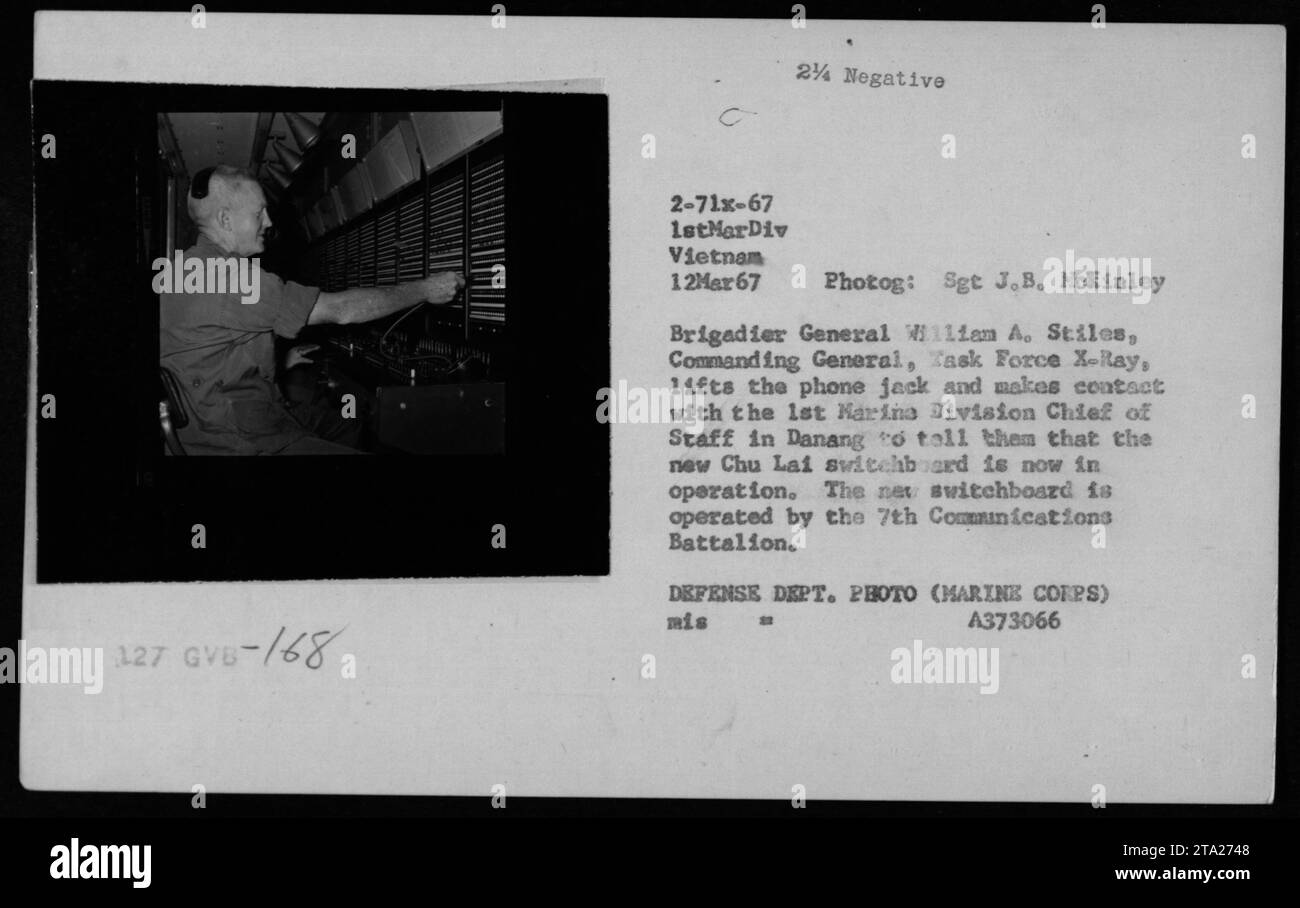 Brigadier General William A. Stiles, Commanding General, Task Force X-Ray, is shown lifting the phone jack to establish communication with the 1st Marine Division Chief of Staff in Danang on March 12, 1967. This photograph captures the moment when General Stiles informs them about the newly operational Chu Lai switchboard, which is operated by the 7th Communications Battalion of the Marine Corps. Stock Photo