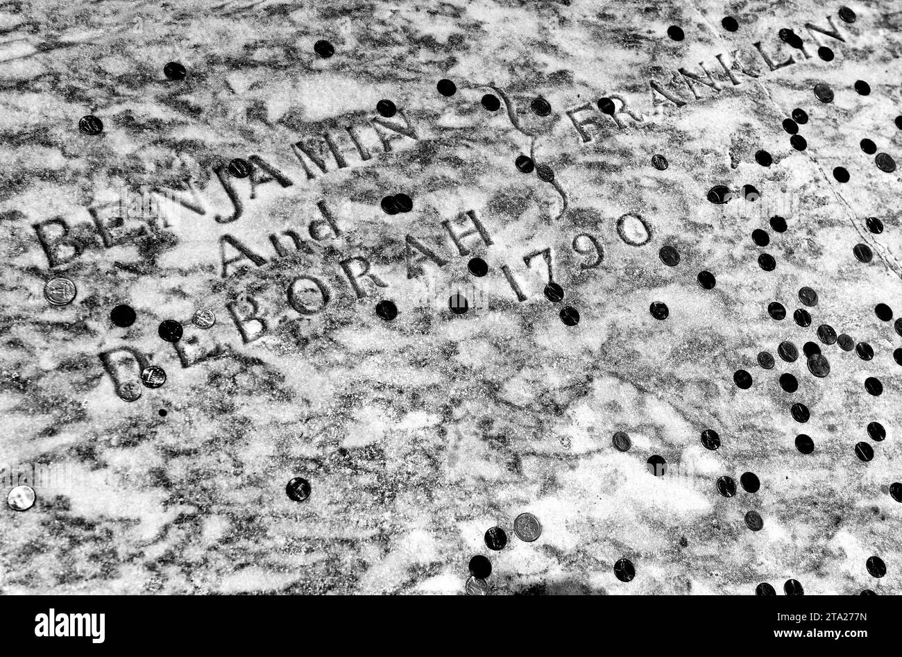 Benjamin Franklin grave covered in coins at Christ Church Burial Ground in Philadelphia, PA, USA Stock Photo