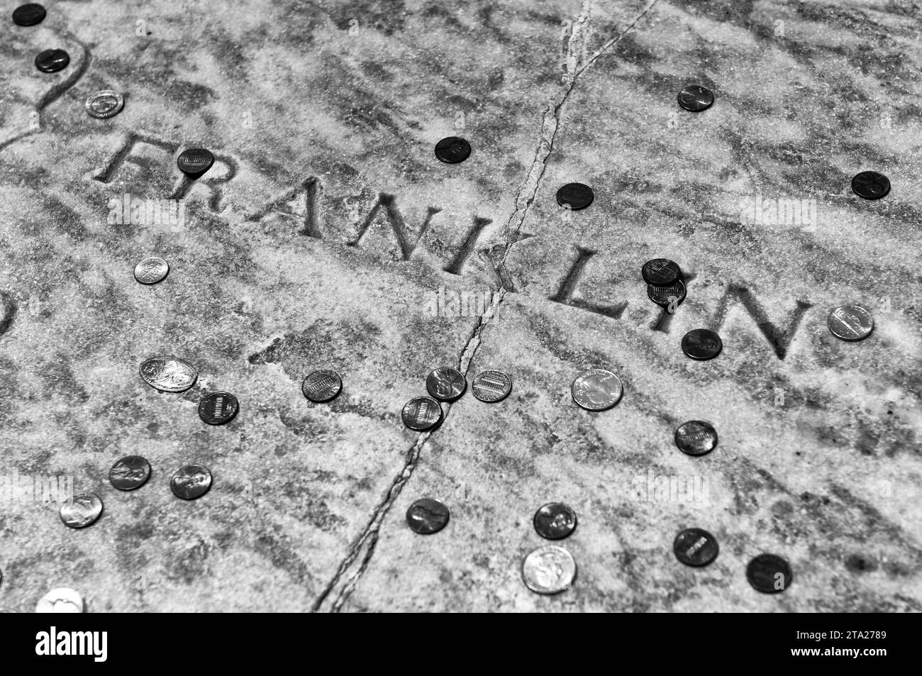 Philadelphia, USA - May 29, 2018: Benjamin Franklin grave covered in coins at Christ Church Burial Ground in Philadelphia, PA, USA Stock Photo