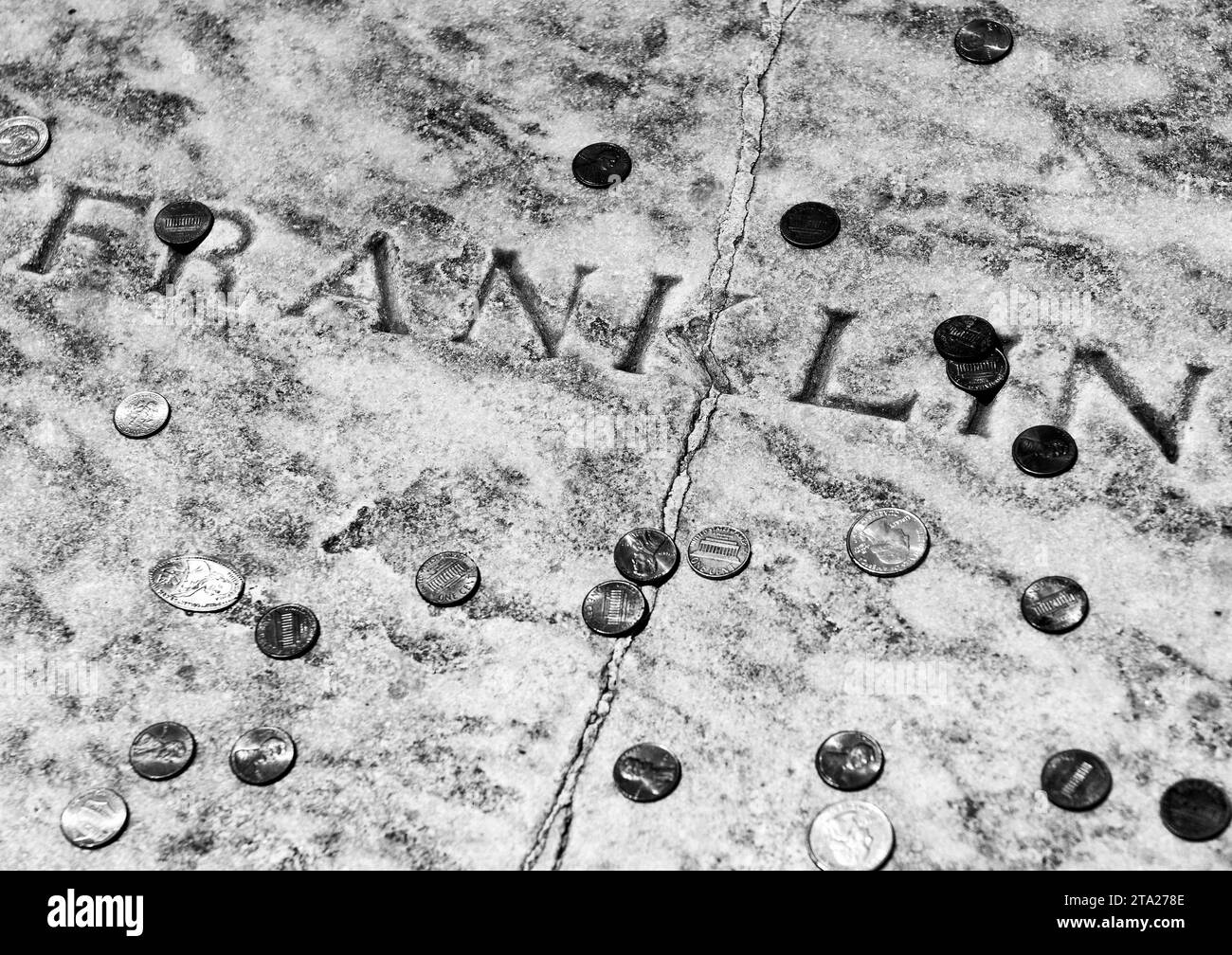 Philadelphia, USA - May 29, 2018: Benjamin Franklin grave covered in coins at Christ Church Burial Ground in Philadelphia, PA, USA Stock Photo