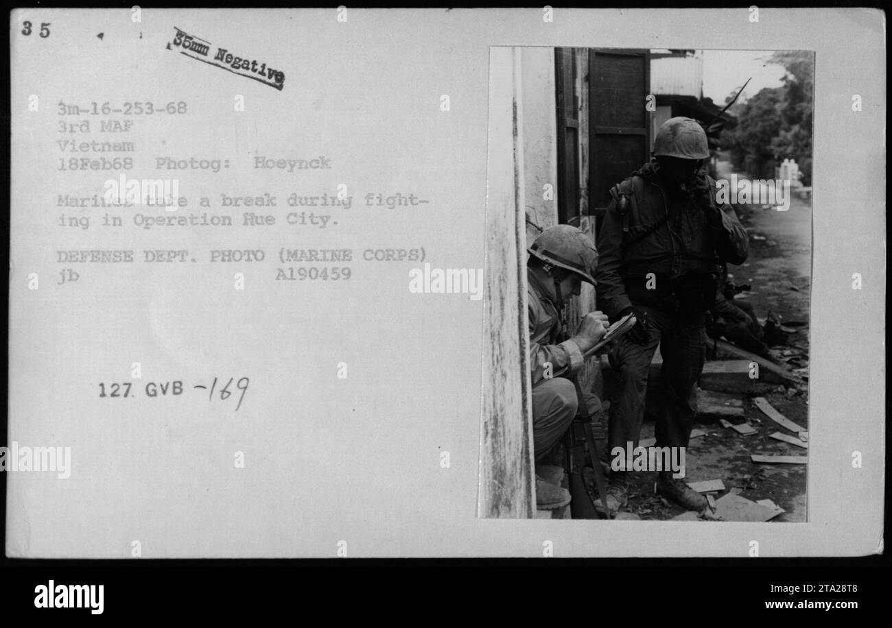 Marines from the 3rd MAF take a break during Operation Flue City, February 18, 1968. The photo captures a moment of rest amidst fighting. Defense Department photo taken by Hoeynck, it shows the reality of military activities during the Vietnam War. Image A190459, GVB -169. Stock Photo