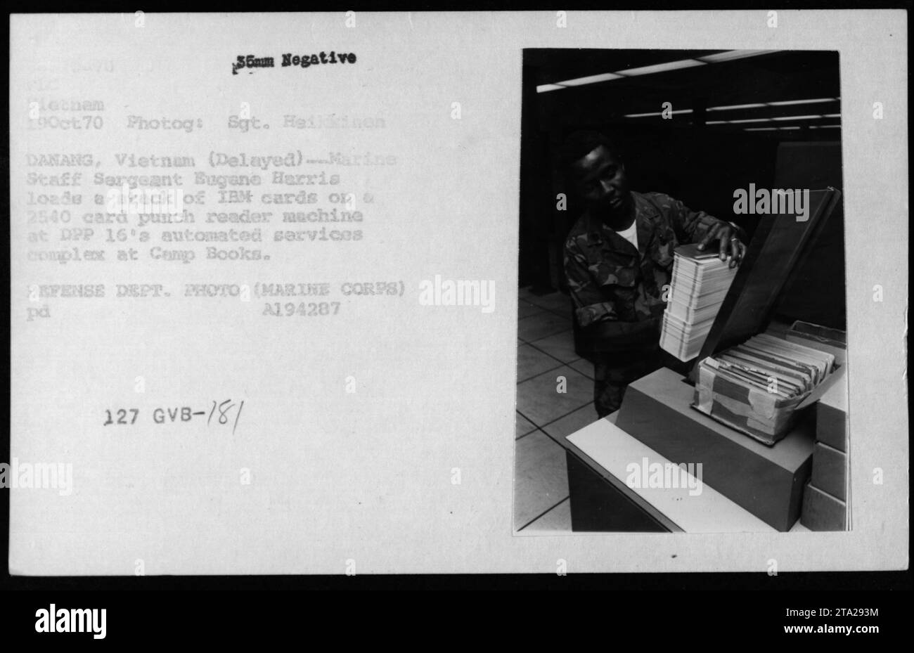 Marine Staff Sergeant Bugane Harris is seen in this photograph loading a stack of IBM cards onto a 2540 card punch reader machine at DPP 16's automated services complex at Camp Books in Danang, Vietnam. This image was taken on October 19, 1970, and was part of the data processing operations conducted by the American military during the Vietnam War. Stock Photo