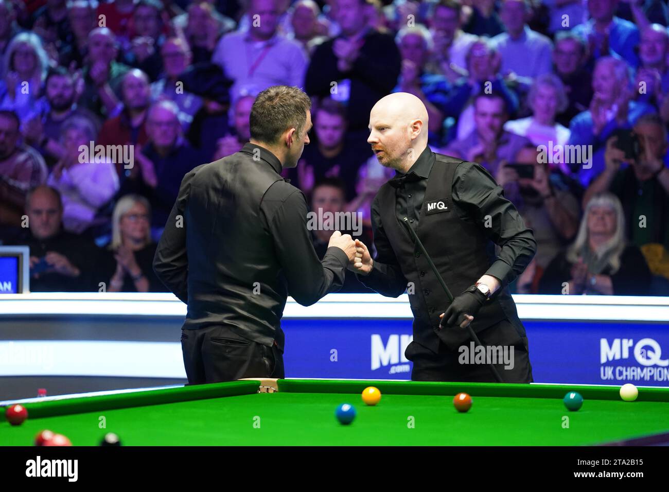 Ronnie O'Sullivan fist bumps with Anthony McGill following their match