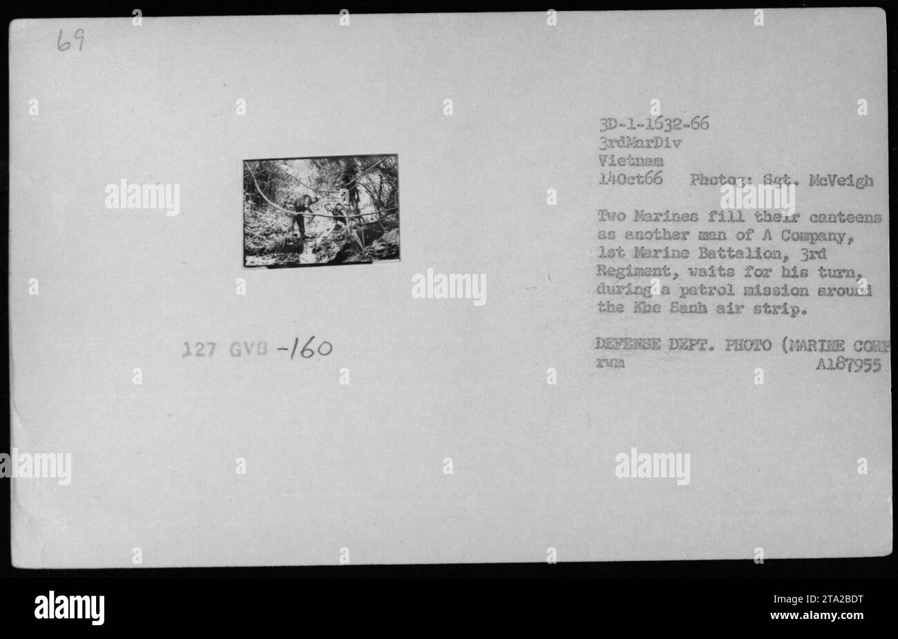 Marines of A Company, 1st Marine Battalion, 3rd Regiment, filling their canteens as they pause during a patrol mission around the Khe Sanh air strip in Vietnam. Photo taken on October 14, 1966 by Sergeant McVeigh, documenting American military activities during the Vietnam War. Stock Photo