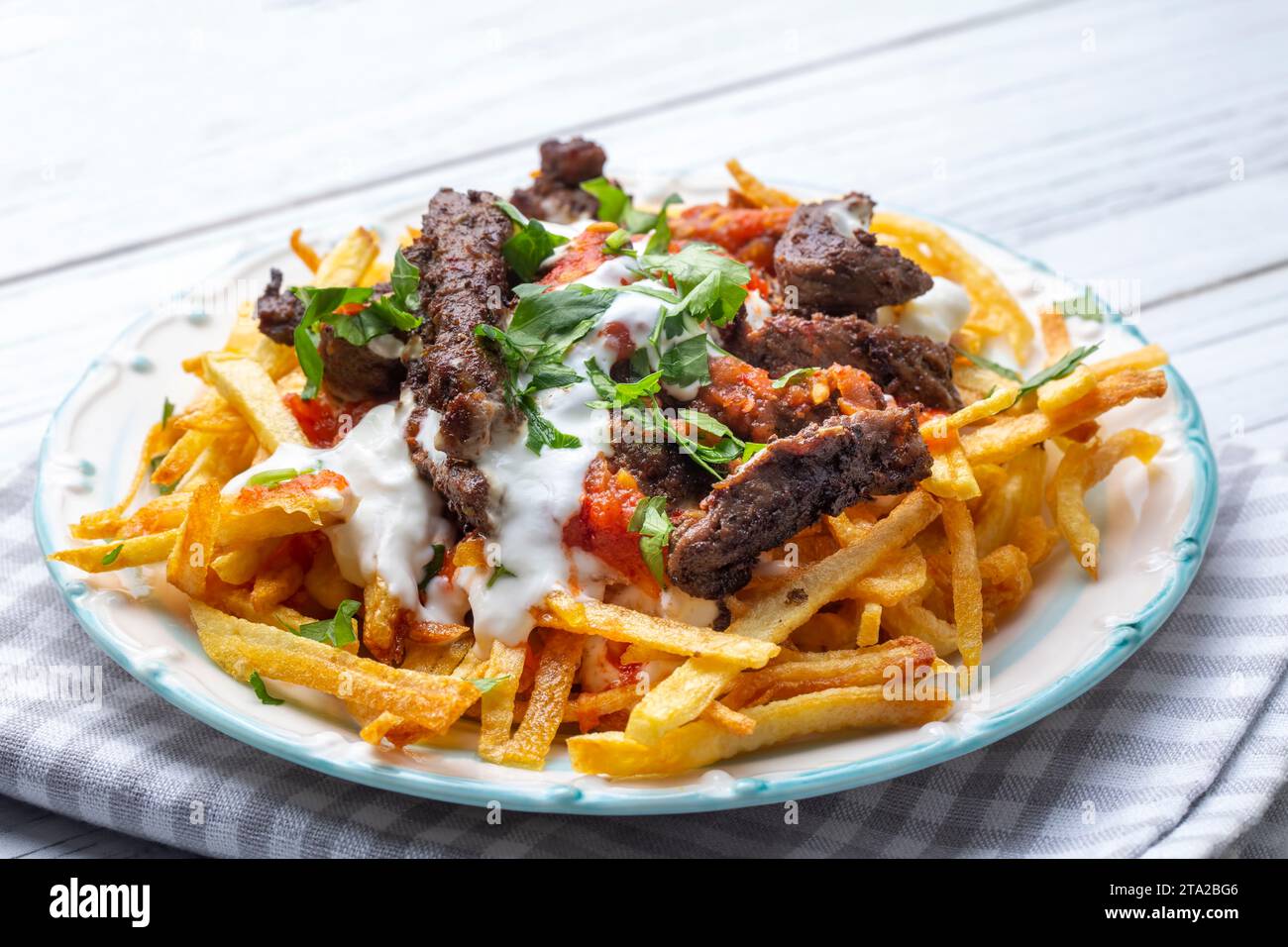 Turkish food; Cokertme Kebab Beef meat kebab with yoghurt and french