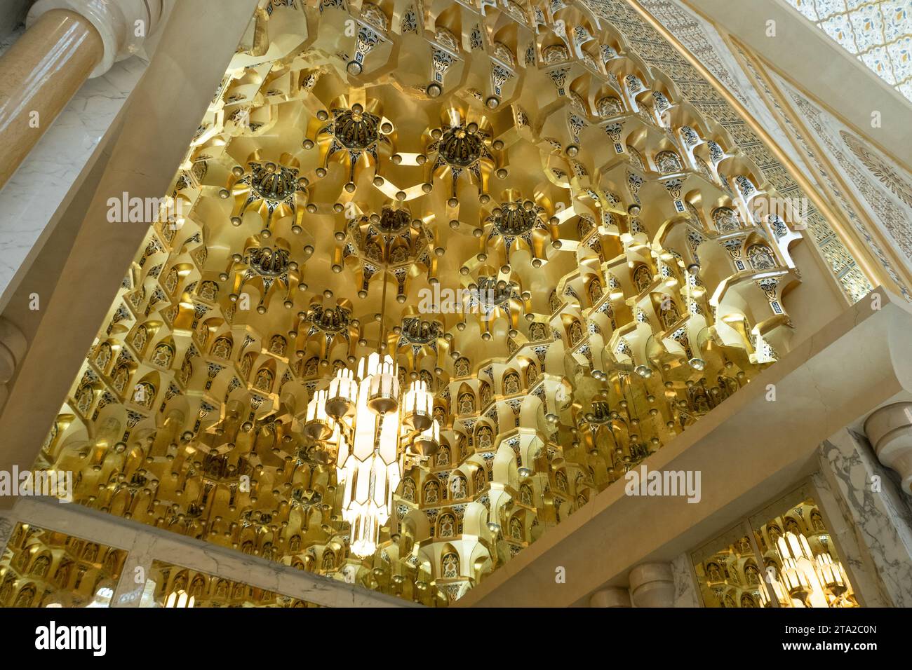 Abu Dhabi, UAE, 08.02.20. Golden muqarnas vaulting with rich Islamic ...