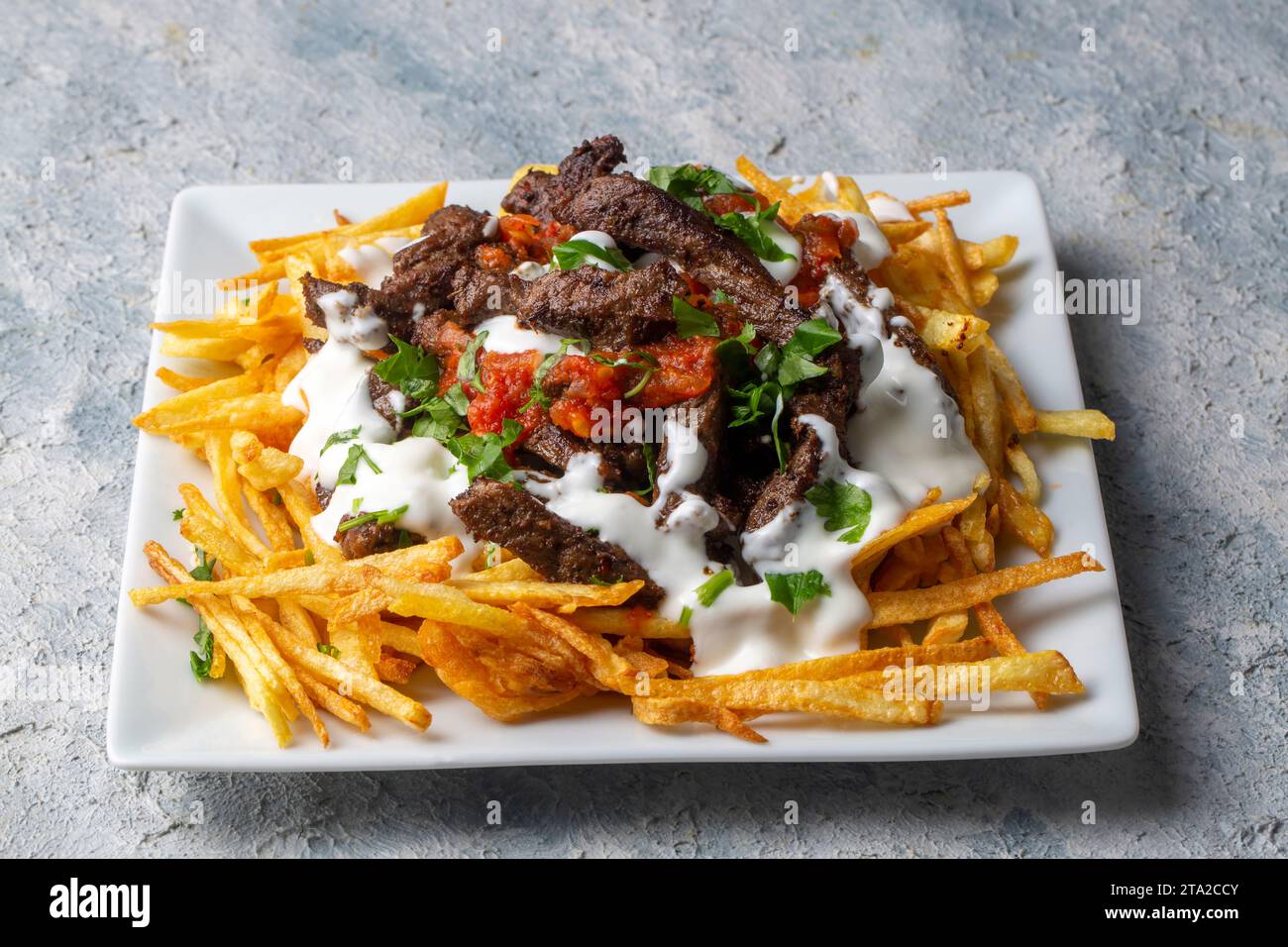 Turkish food; Cokertme Kebab Beef meat kebab with yoghurt and french