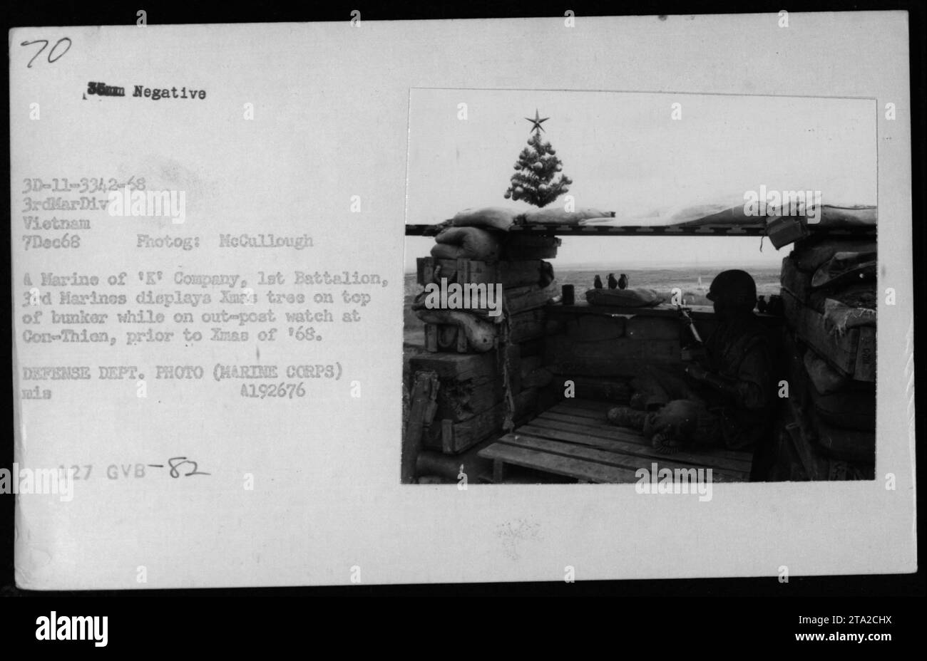 Marine of K Company, 1st Battalion, 3rd Marines in Vietnam, on December 7, 1968, displays a Christmas tree on top of a bunker while on outpost watch at Con-Thien. The display was in preparation for Christmas celebrations during the holiday season of '68. (Source: Defense Department photo by McCullough & Marine) Stock Photo