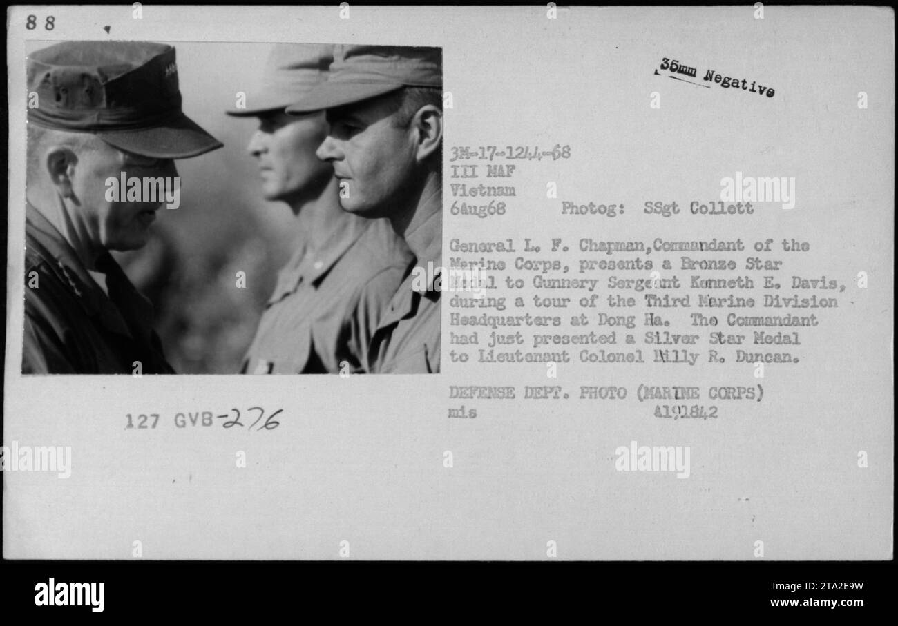 General L. F. Chapman, Commandant of the Marine Corps, presents a