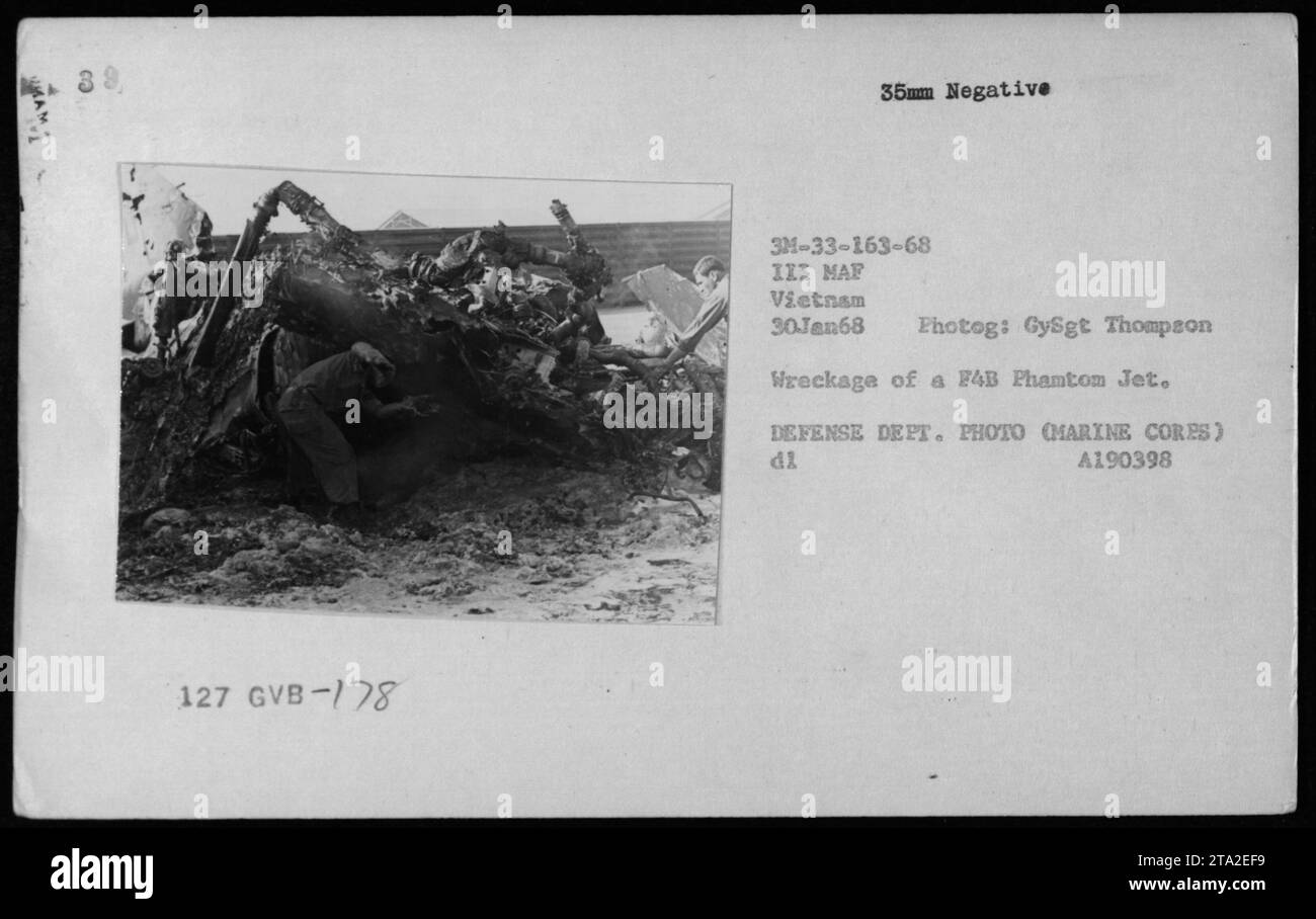 Wreckage of a FAB Phantom Jet in Vietnam, January 30, 1968. The image shows a damaged plane, and it was taken by GySgt Thompson during military activities in Vietnam. This photograph is from the collection of the III MAF (III Marine Amphibious Force) and was taken as an official Defense Department photo. Stock Photo