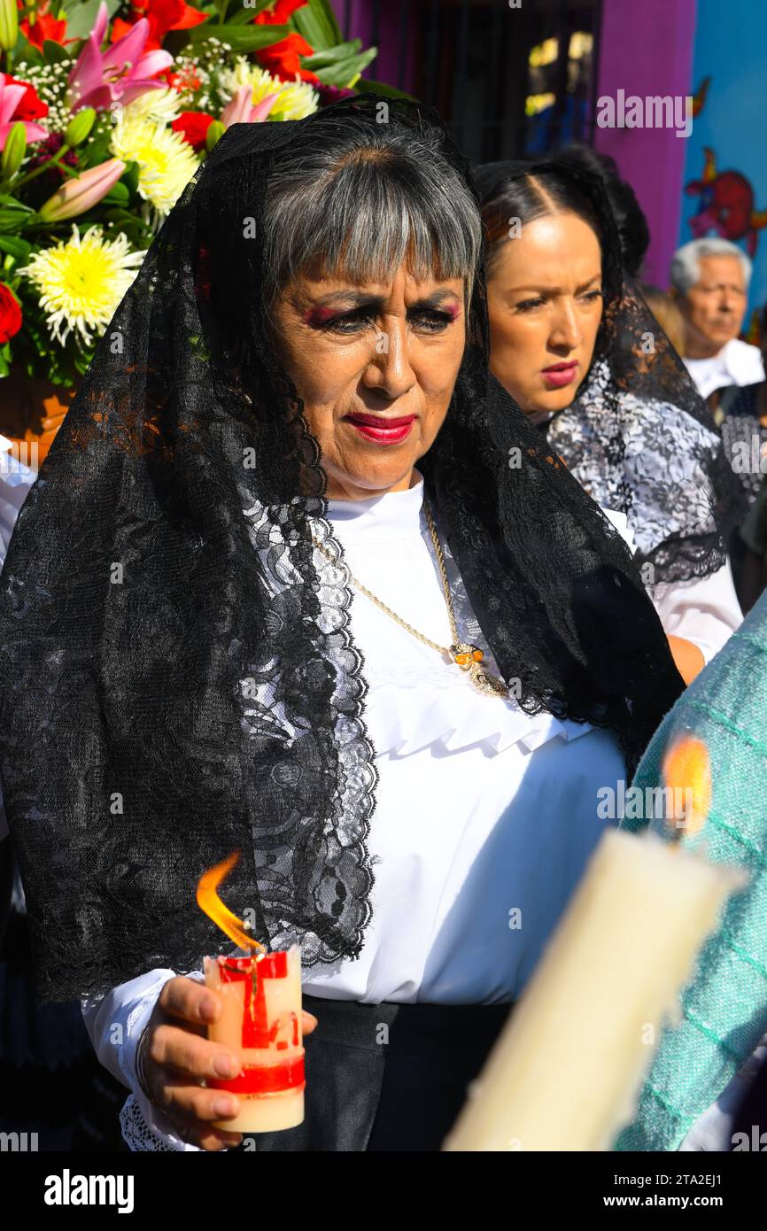 Mexican female believer holding a candle, Good Friday, morning Silent procession, City of Oaxaca, Mexico Stock Photo