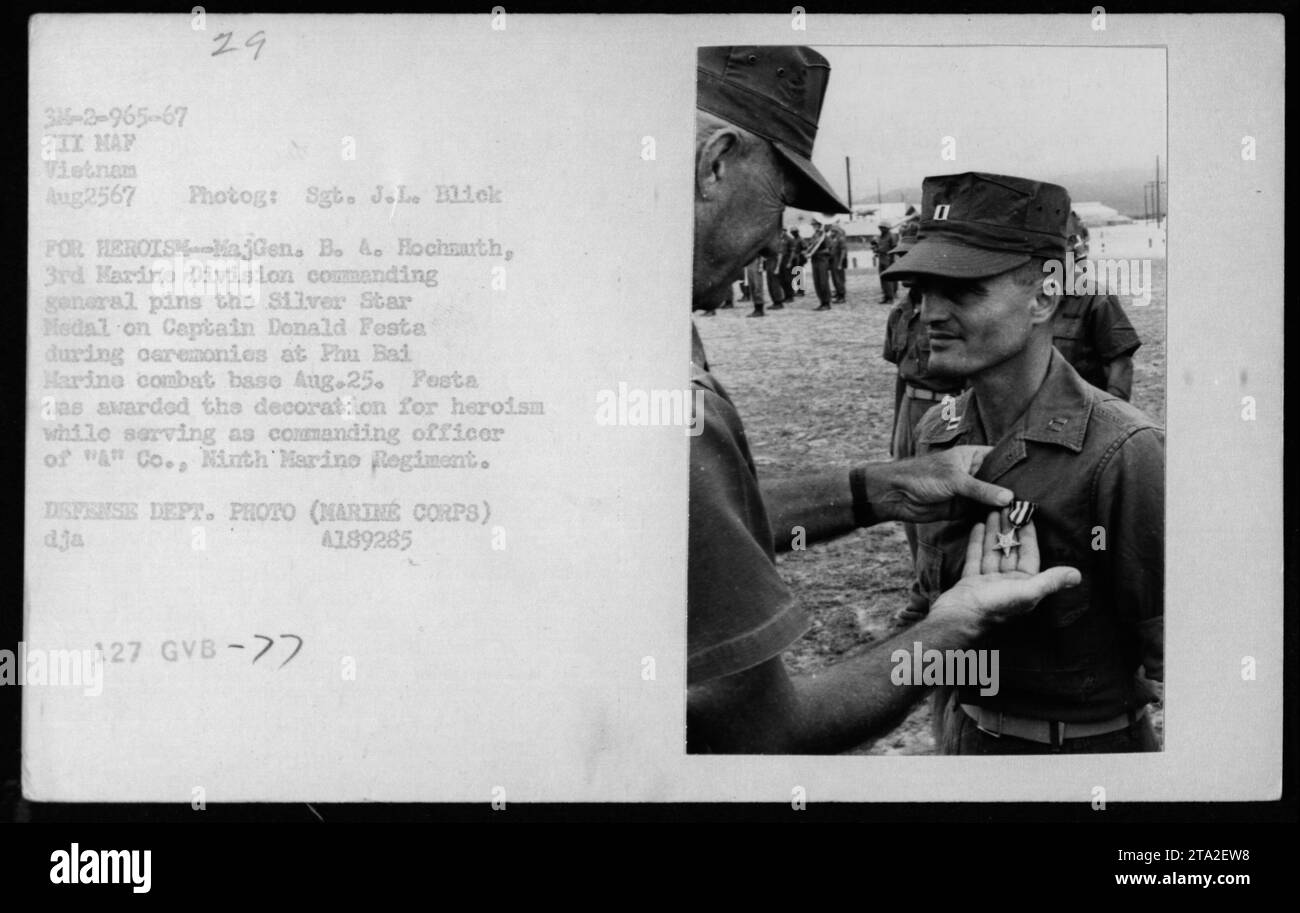 Major General B.A. Hochmuth, 3rd Marine Division commanding general, pins the Silver Star Medal on Captain Donald Festa during a ceremony at Phu Bad Harine combat base on August 25, 1967. Captain Festa received the decoration for heroism while serving as commanding officer of 'A' Co., Ninth Marine Regiment. The photograph is from the Defense Department. Stock Photo