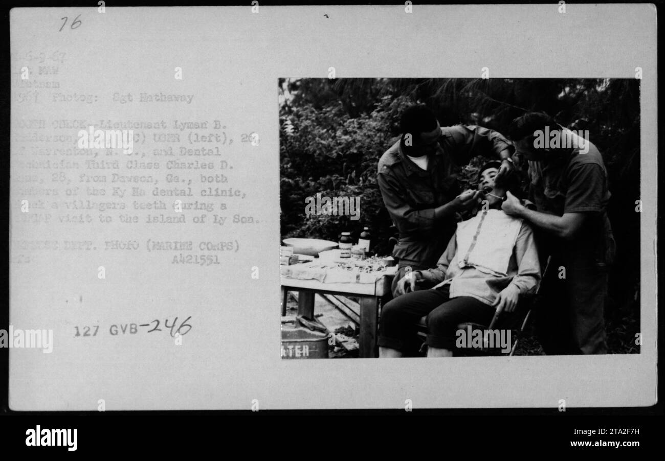 Lieutenant Lyman B. Anderson Jr. and Dental Technician Third Class Charles D. Davidson, members of the Ky Ha dental clinic, check a villager's teeth during a MEDCAP visit to the island of Ly Son in 1967. This image captures the medical activities carried out by American military personnel during the Vietnam War. Stock Photo