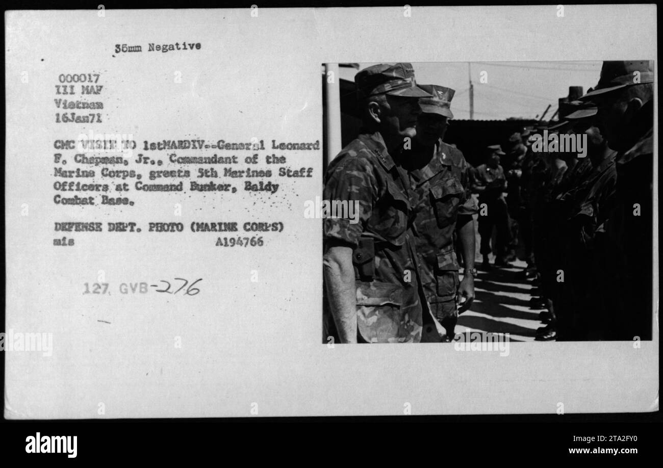 General Leonard F. Chapman, Jr., the Commandant of the Marine Corps, visits the 1st Marine Division in Vietnam. In this photograph, he is seen greeting the staff officers of the 5th Marines at the Command Bunker in Baldy Combat Base. The photo was taken on January 16, 1971, and is a part of the Defense Department's collection (Marine Corps). Stock Photo