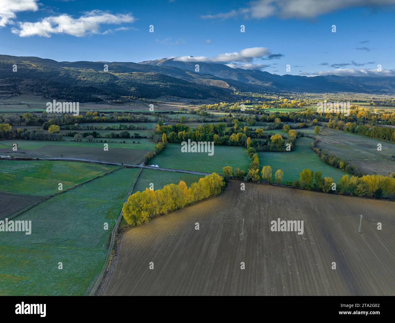 Aerial view of the city of Puigcerdà and its rural surroundings on an autumn morning (Cerdanya, Catalonia, Spain, Pyrenees) Stock Photo