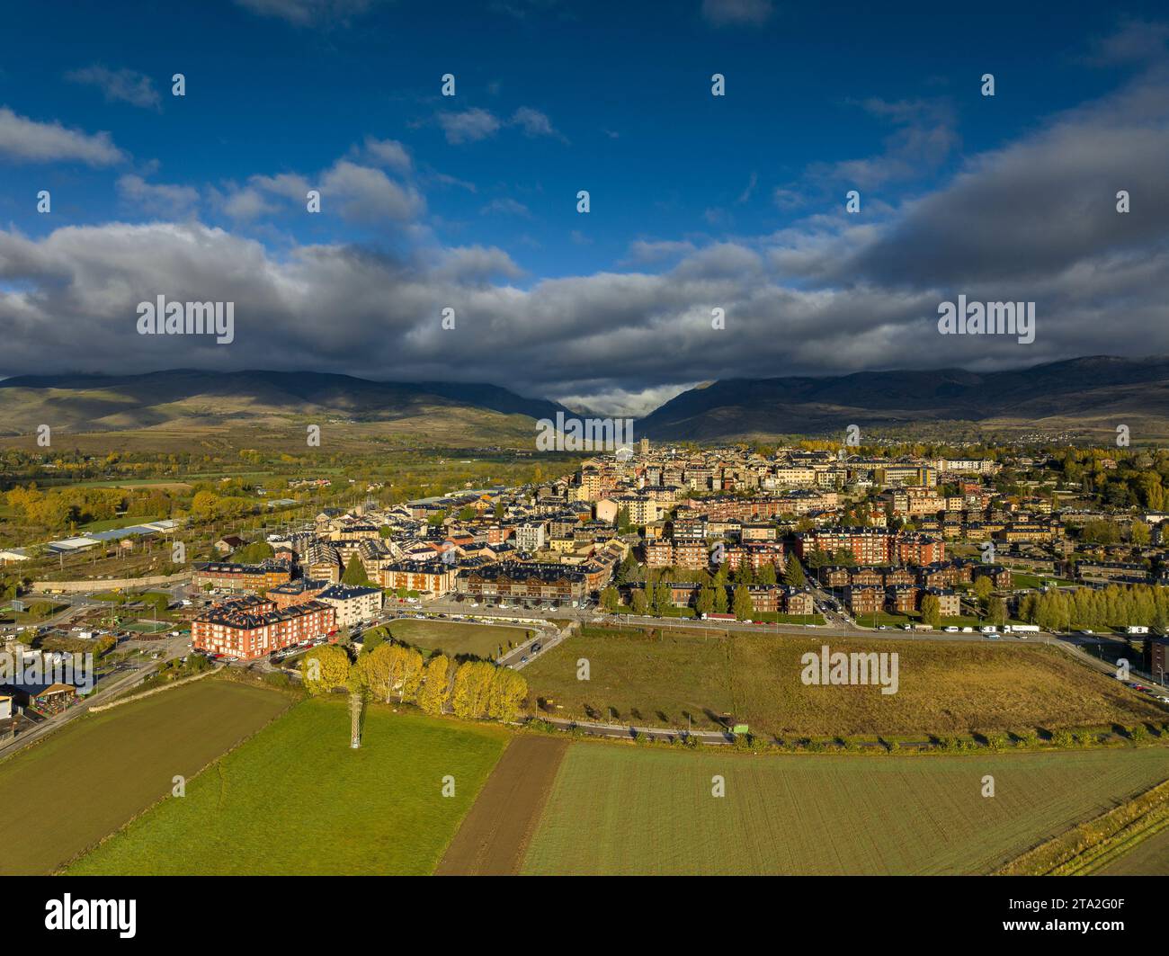 Aerial view of the city of Puigcerdà and its rural surroundings on an autumn morning (Cerdanya, Catalonia, Spain, Pyrenees) Stock Photo