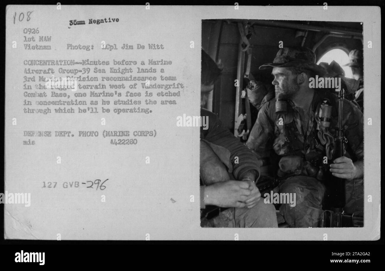 A Marine in the photograph is seen concentrating as he studies the