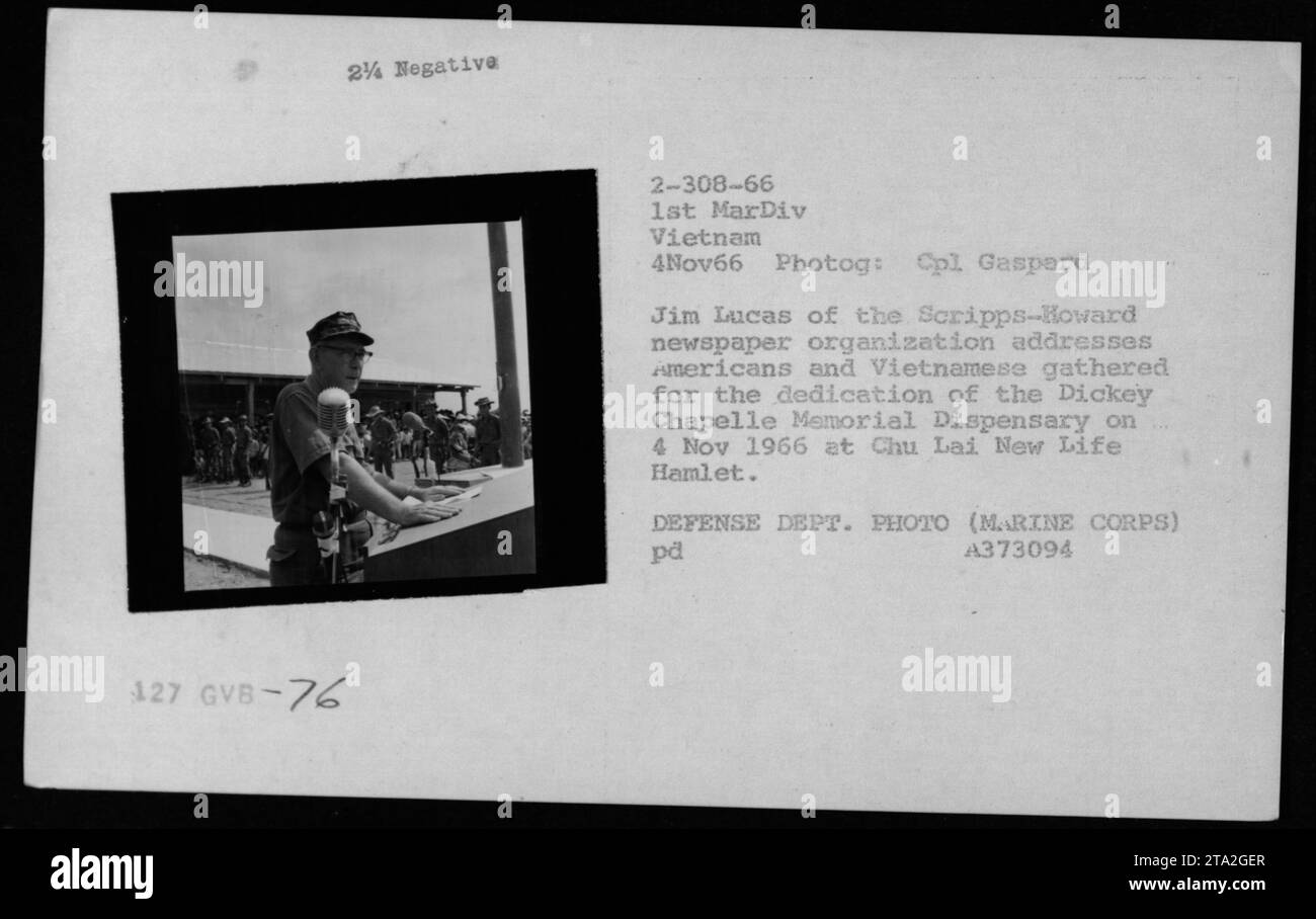 Caption: Cpl Gaspard Jim Lucas of the Scripps-Howard newspaper organization addressing Americans and Vietnamese at the dedication of the Dickey Chapelle Memorial Dispensary on November 4, 1966 at Chu Lai New Life Hamlet. The ceremony was attended by members of the 1st MarDiv Vietnam and marked a significant event in the Vietnam War. DEFENSE DEPT. PHOTO (MARINE CORPS) pd A373094. Stock Photo