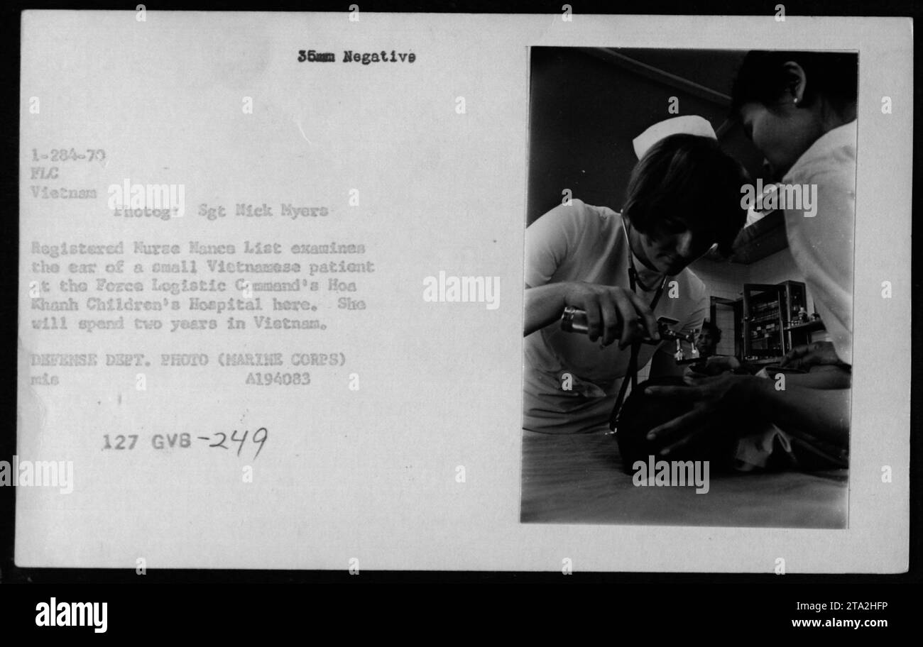 Registered Nurse Nance Lisk examines the ear of a small Vietnamese patient at the Force Logistic Command's Hoa Khanh Children's Hospital in Vietnam. Lisk, along with Sgt. Nick Myers, spent two years in Vietnam providing medical care for local children. This image is a 35mm negative from 1970 during the Vietnam War. DEFENSE DEPT. PHOTO (MARINE CORPS) mis A194083 127 GVB-249 Stock Photo