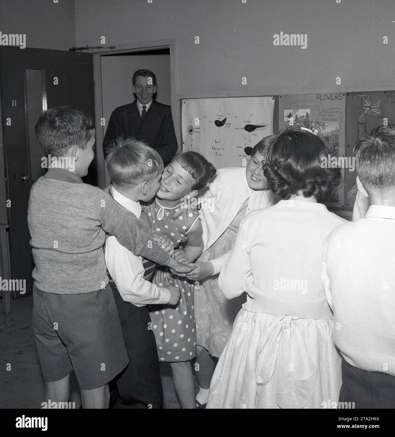 1960s, historical, primary school, in a classroom, excited boys and