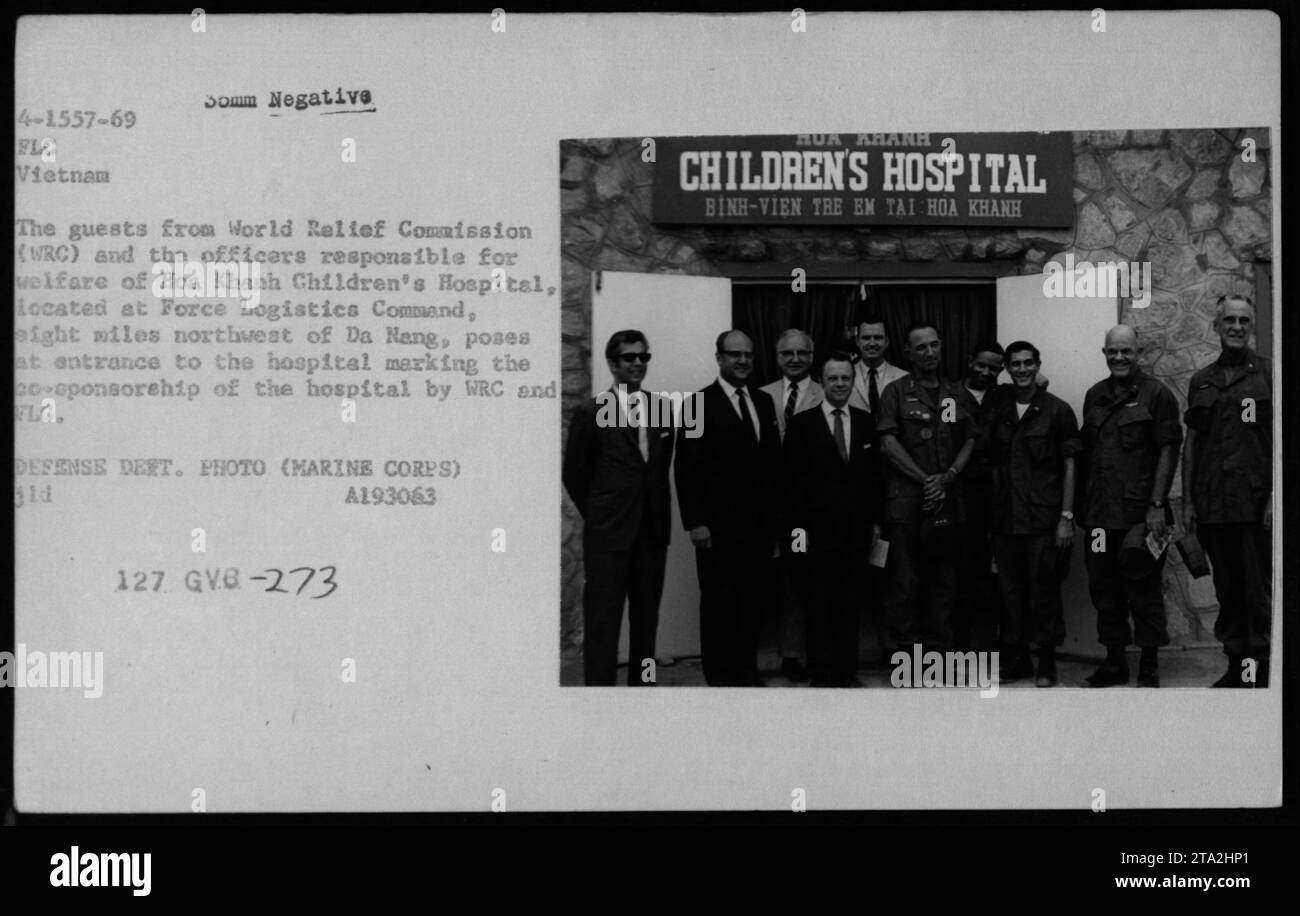 'US military officials and guests from the World Relief Commission (WRC) stand at the entrance of Hoa Khanh Children's Hospital, located at Force Logistics Command, eight miles northwest of Da Nang, Vietnam. The photo marks the joint sponsorship of the hospital by WRC and FLG. Defense Department photo (Marine Corps) ld A193063 127.' Stock Photo