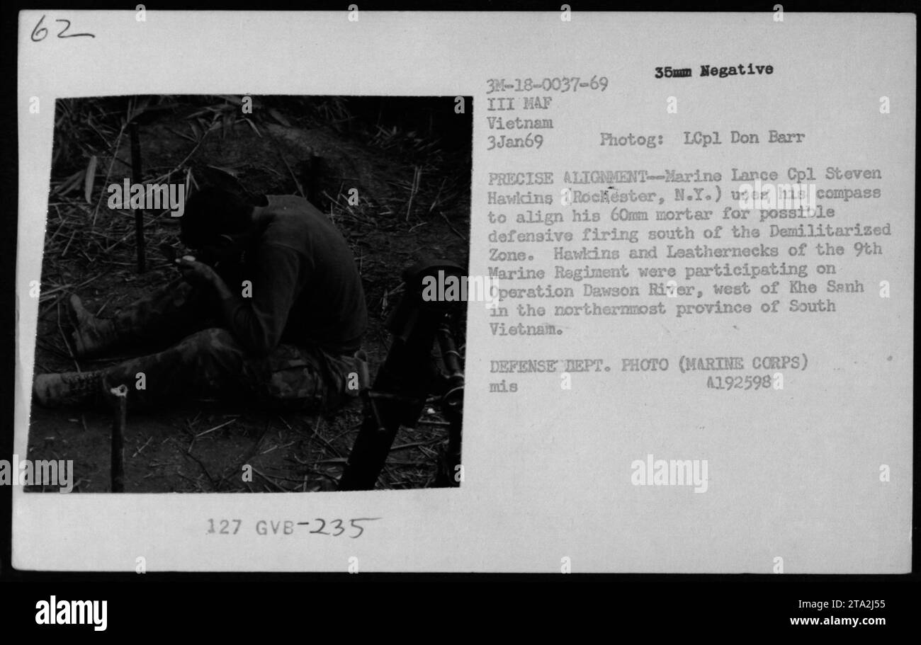 Marine Lance Cpl. Steven Hawkins, from Rochester, NY, uses his compass to align his 60mm mortar for defensive firing south of the Demilitarized Zone during Operation Dawson River. This operation took place west of Khe Sanh in the northernmost province of South Vietnam on January 3, 1969. Photog: LCpl Don Barr. (DEFENSE DEPT. PHOTO, Provided by MARINE CORPS) Stock Photo