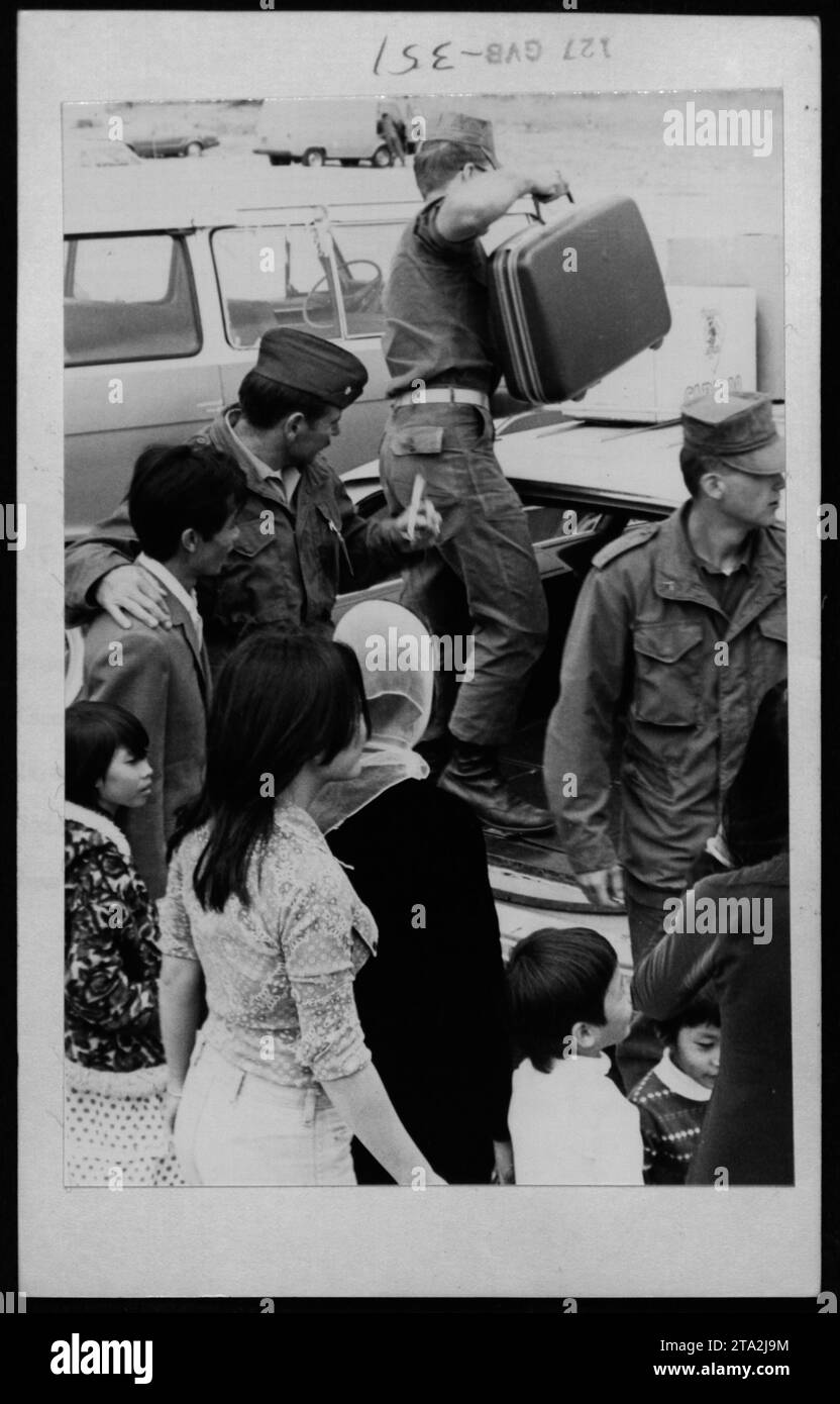 Vietnamese refugees in the United States receive a visit from Claudia Cardinale, Nguyen Cao Ky, Rosemary Clooney, and Betty Ford on June 17, 1975. This image captures the humanitarian efforts and support provided to those affected by the Vietnam War. Stock Photo
