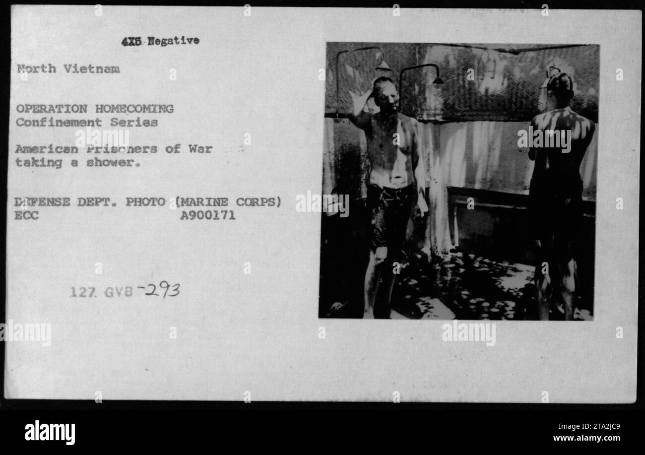 American POWs take a shower in North Vietnam during the Vietnam War as ...