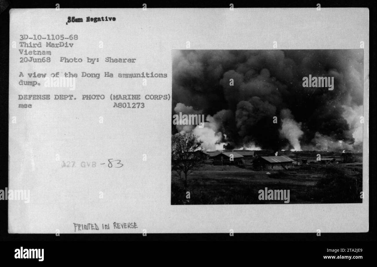 A photograph taken on June 20, 1968, during the Vietnam War shows the Dong Ha ammunitions dump. The image, captured by Shearer, depicts a view of the location. It is a negative 3D-10-1105-68 from the Third Marine Division, Vietnam. The photo is in reverse as indicated by the DEFENSE DEPT. PHOTO (MARINE CORPS) A801273 mee 27. Chemical warfare was a relevant aspect during this period. Stock Photo