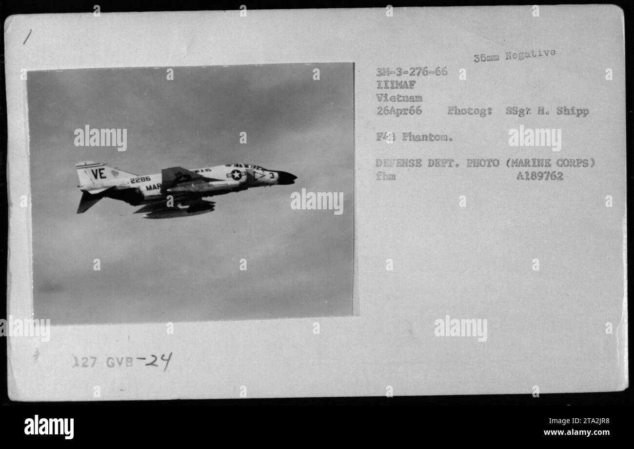 A F-4 Phantom aircraft flying over Vietnam during the Vietnam War. Captured on April 26, 1966, the F-4B Phantom bears the identification numbers VE 2286 and MAR 127 GVB-24. The photograph was taken on a 35mm negative by SSgt H. Shipp of LIIMAF. It is a defense department photo from the Marine Corps. Stock Photo