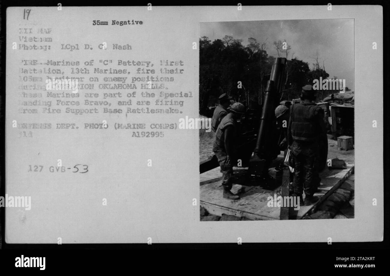 Members of "C" Battery, First Battalion, 13th Marines, are seen firing
