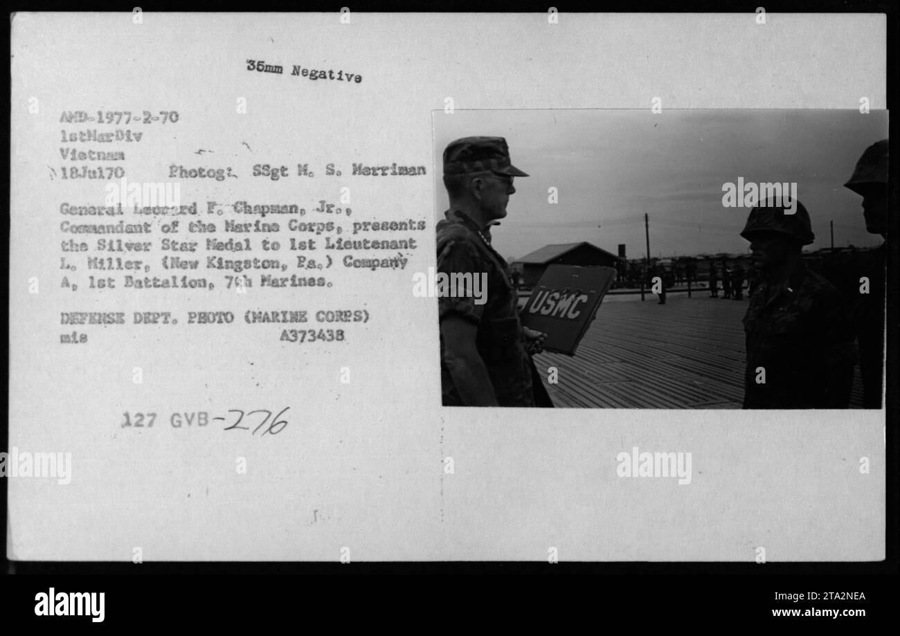 'General Leonard F. Chapman, Jr., Commandant of the Marine Corps, presents the Silver Star Medal to 1st Lieutenant Lo Miller of Company A, 1st Battalion, 7th Marines during the Vietnam War. The photograph was taken on July 18, 1970. (Photographer: SSgt H. S. Merriman, Defense Dept. Photo - USMC)' Stock Photo