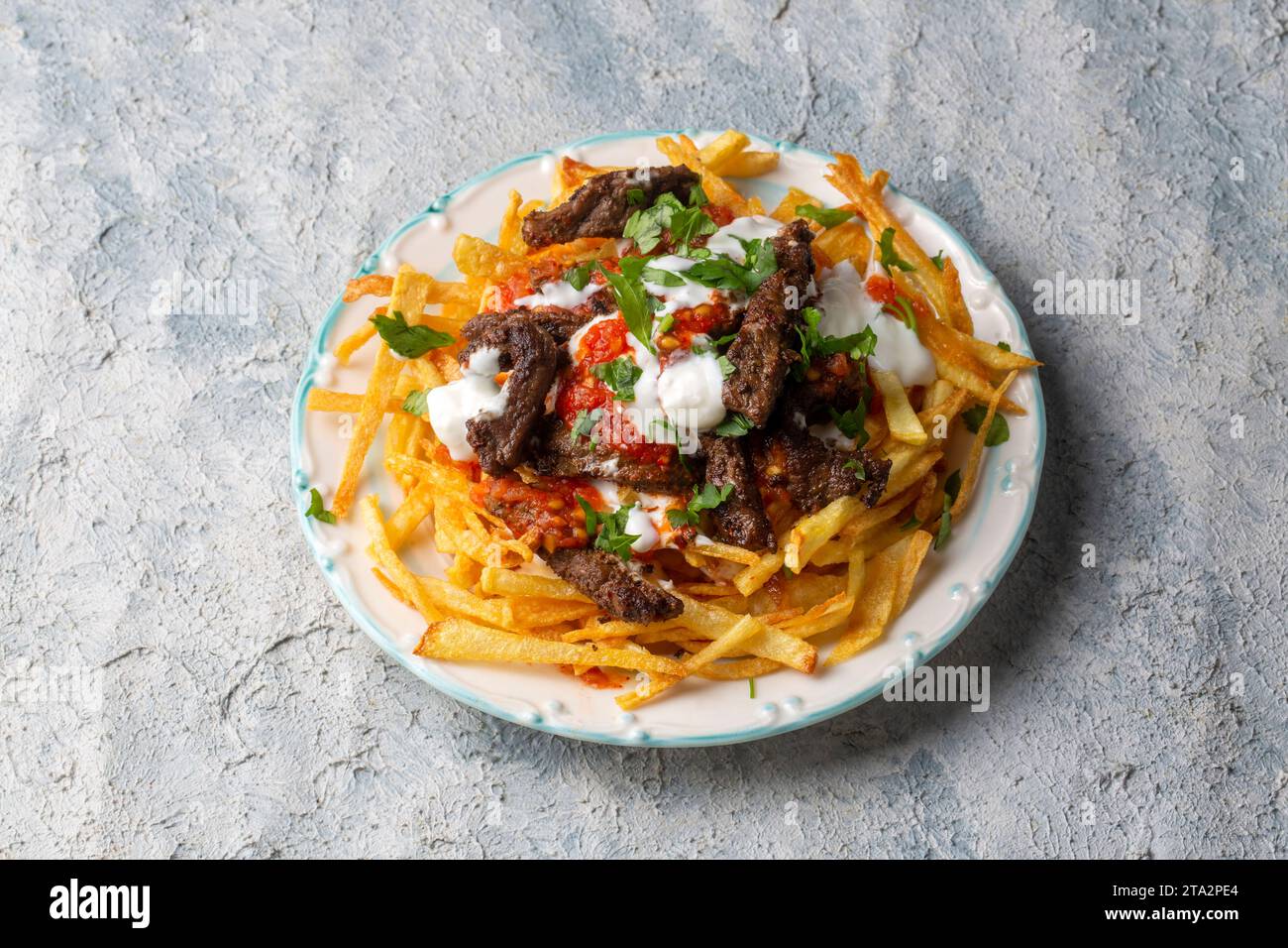Turkish food; Cokertme Kebab Beef meat kebab with yoghurt and french