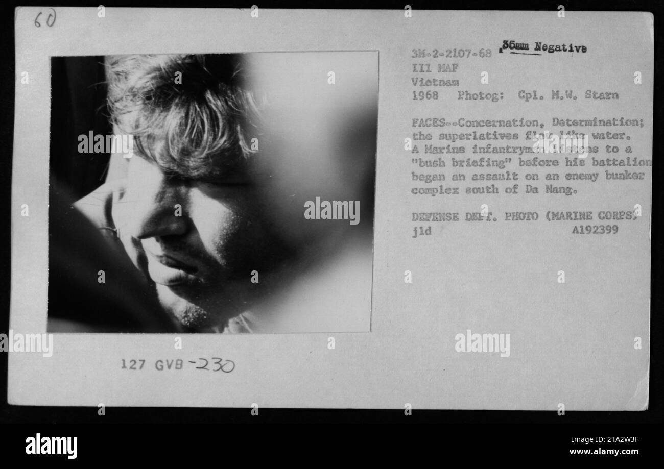 A US Marine receives a "bush briefing" in 1968 before his battalion