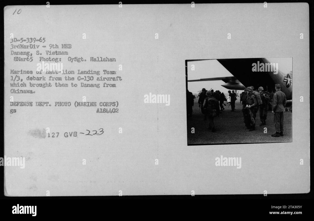 Marines from Battalion Landing Team 1/3 debarking from a C-130 aircraft upon arrival in Danang, South Vietnam on March 8, 1965. This image shows helicopters hovering nearby, ready for troops to embark or disembark. Photo taken by GySgt. Hallahan, sourced from the Defense Dept. (Marine Corps) archives. Stock Photo