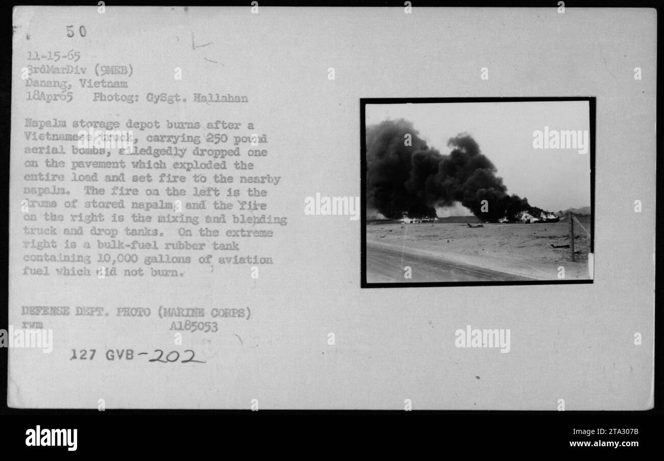 Napalm storage depot burns after a Vietnamese truck allegedly dropped a 250 pound aerial bomb, causing the entire load to explode and set fire to nearby napalm. The fire on the left is from drums of stored napalm, while the fire on the right is from a mixing and blending truck. A bulk-fuel rubber tank containing 10,000 gallons of aviation fuel did not burn. Taken on April 18, 1965 in Danang, Vietnam by GySgt. Hallahan. Defense Dept. Photo (Marine Corps) A185053 127 GVB-202. Stock Photo