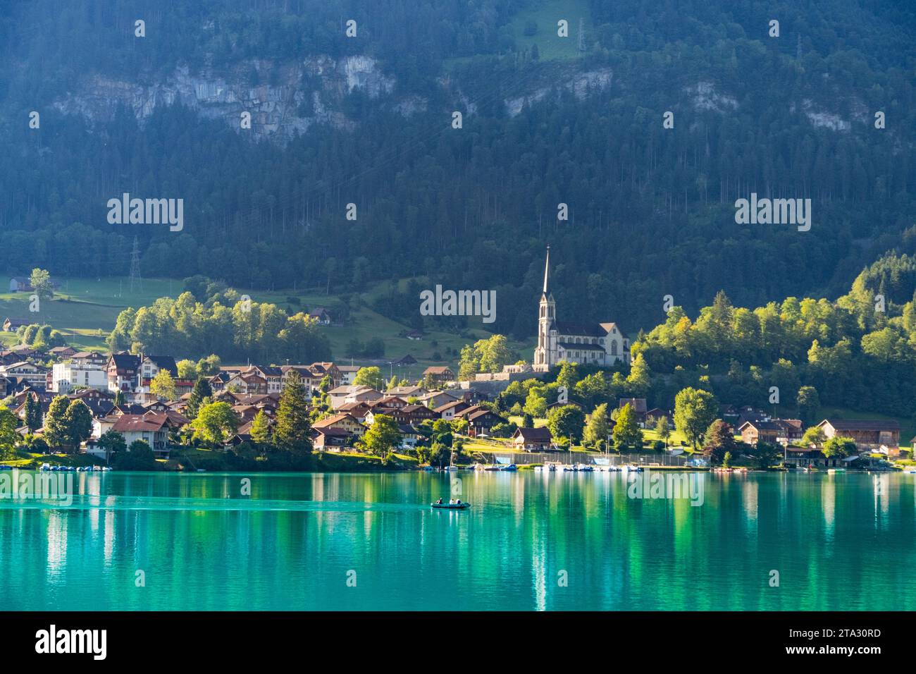 Swiss village Lungern with traditional houses, old church Alter
