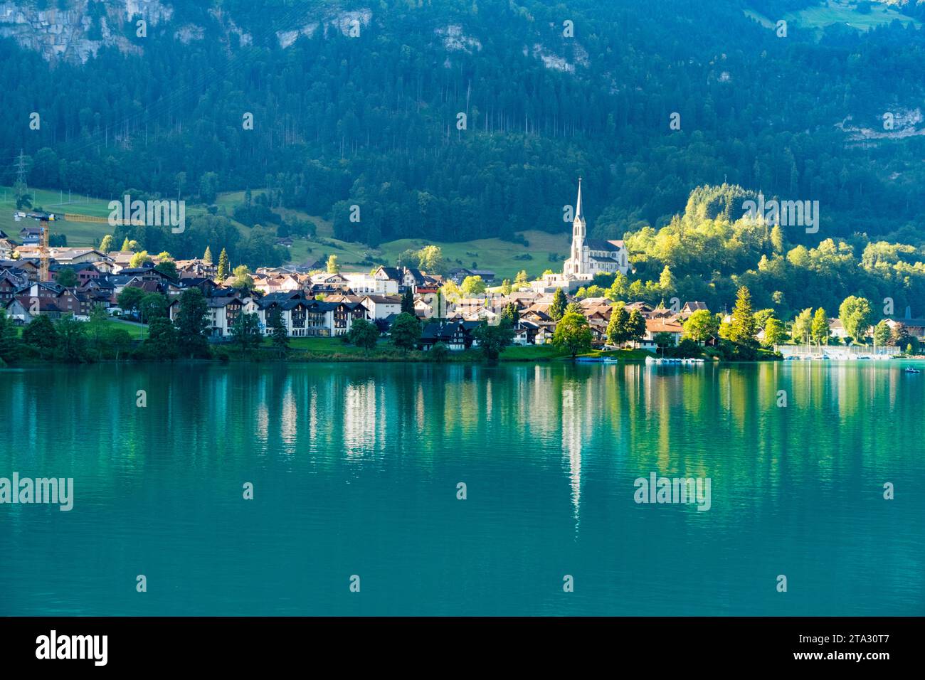 Swiss village Lungern with traditional houses, old church Alter