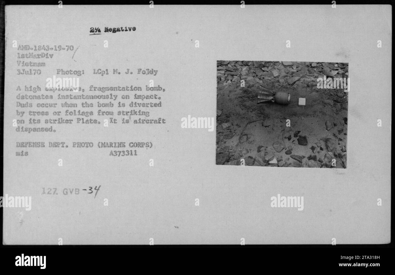 'July 3, 1970: A photograph captured by LCpl H.J. Foldy shows the fragment bomb being dropped from an aircraft during the Vietnam War. These high explosive bombs detonate upon impact, causing deadly fragmentation. Duds can occur if the bomb hits trees or foliage. Defense Department photo (Marine Corps), file number A373311 127. GVB-34.' Stock Photo